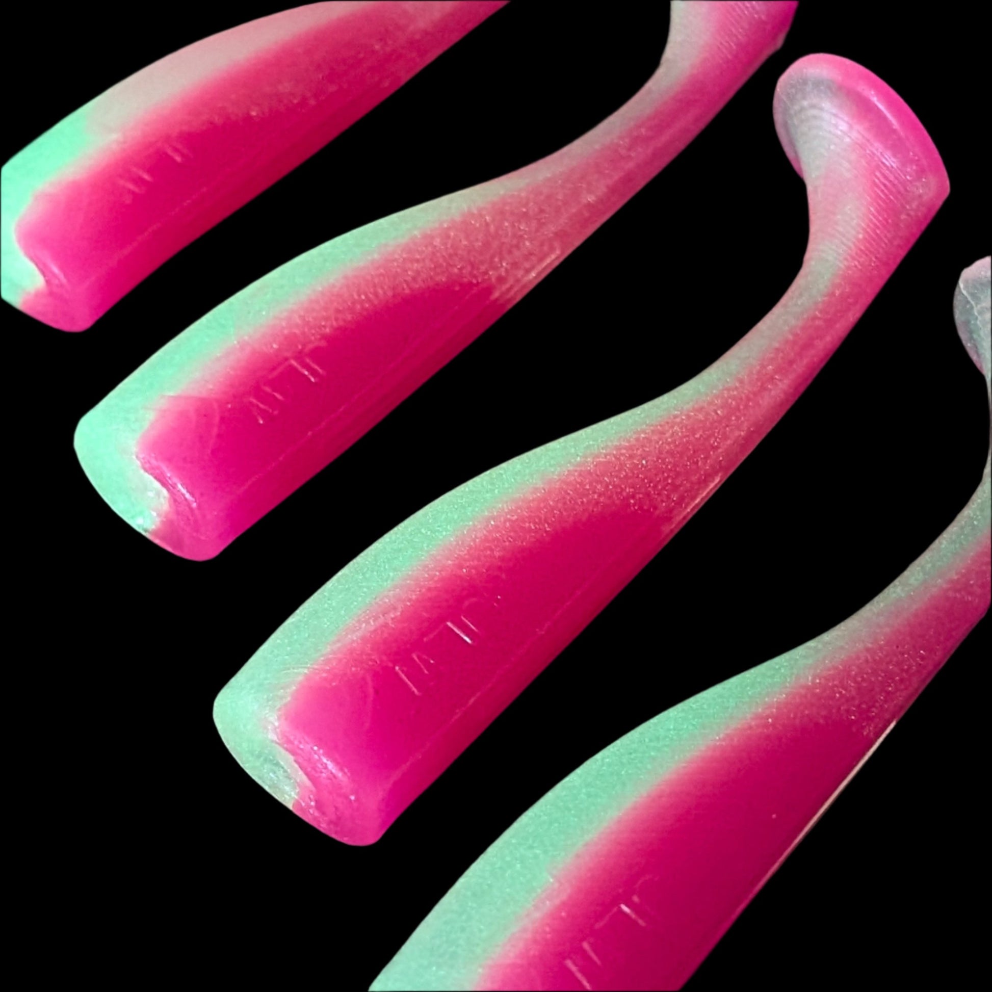 4 inch paddle tail swim bait in Pink Glo  – Jonah Lure Works Nine Lives Soft Plastic Swim Bait. Fresh and salt water rated.
